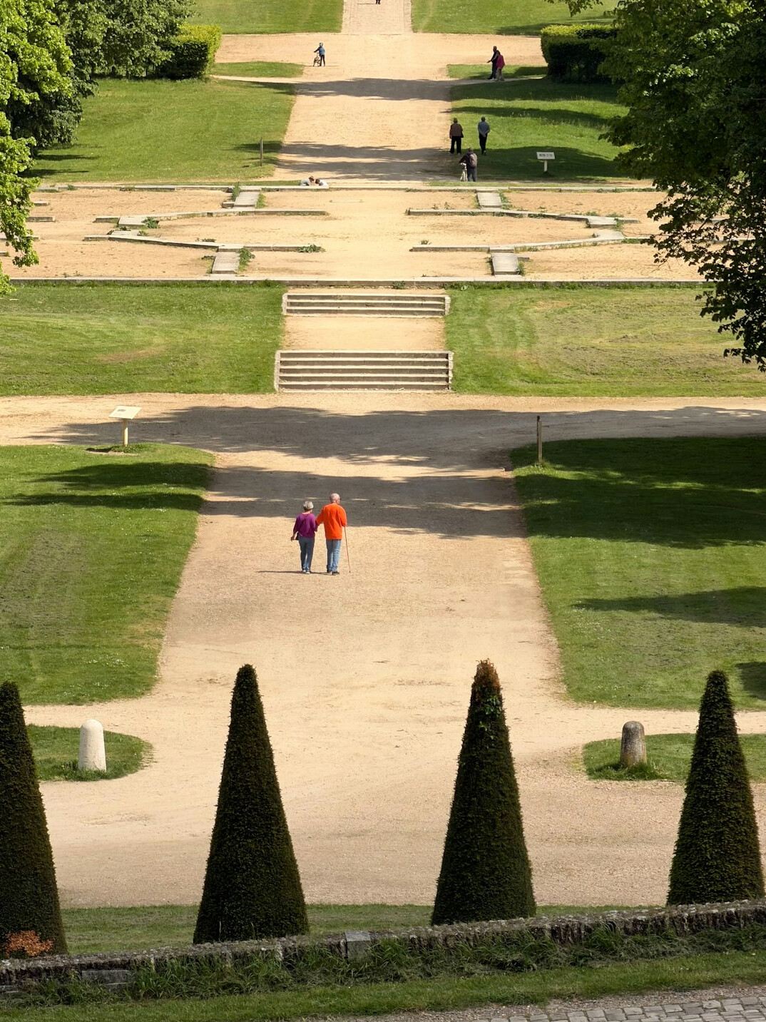 elderly couple walking in park